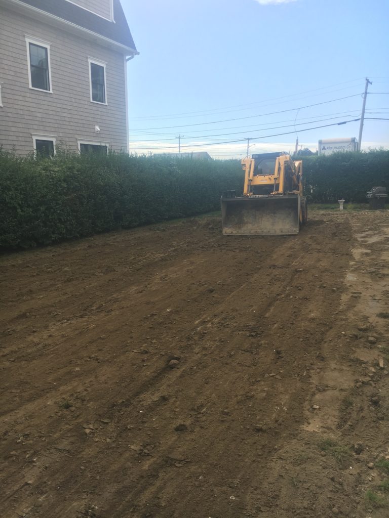 House with tractor grading yard