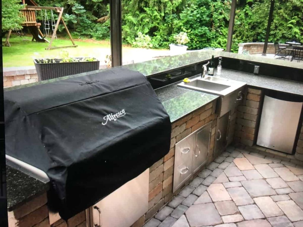Outdoor grill with countertop, sink, drawers